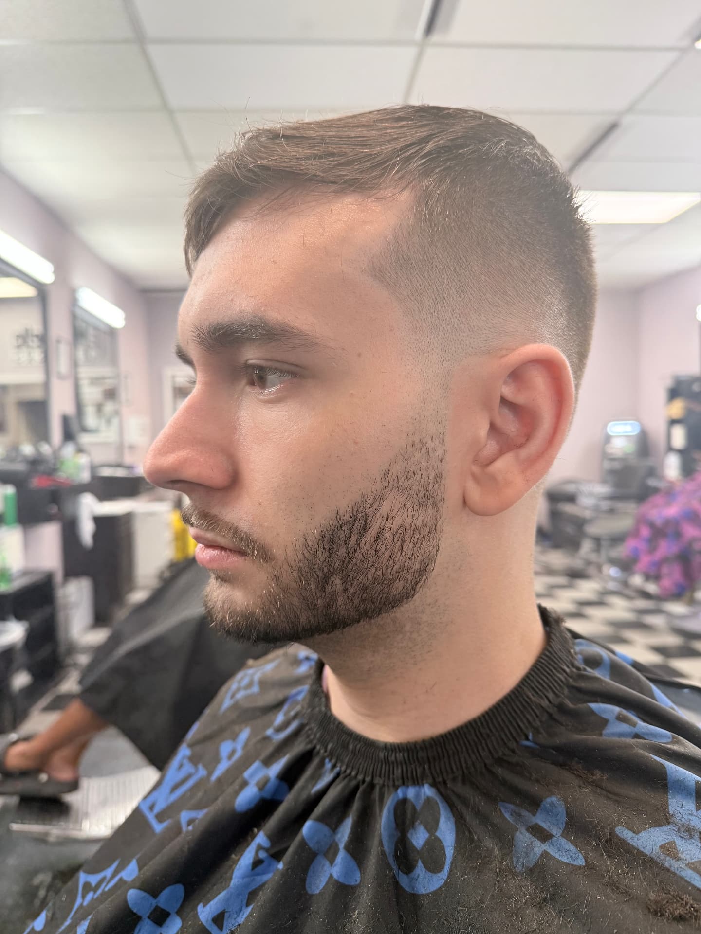 Fresh taper haircut and shaped beard