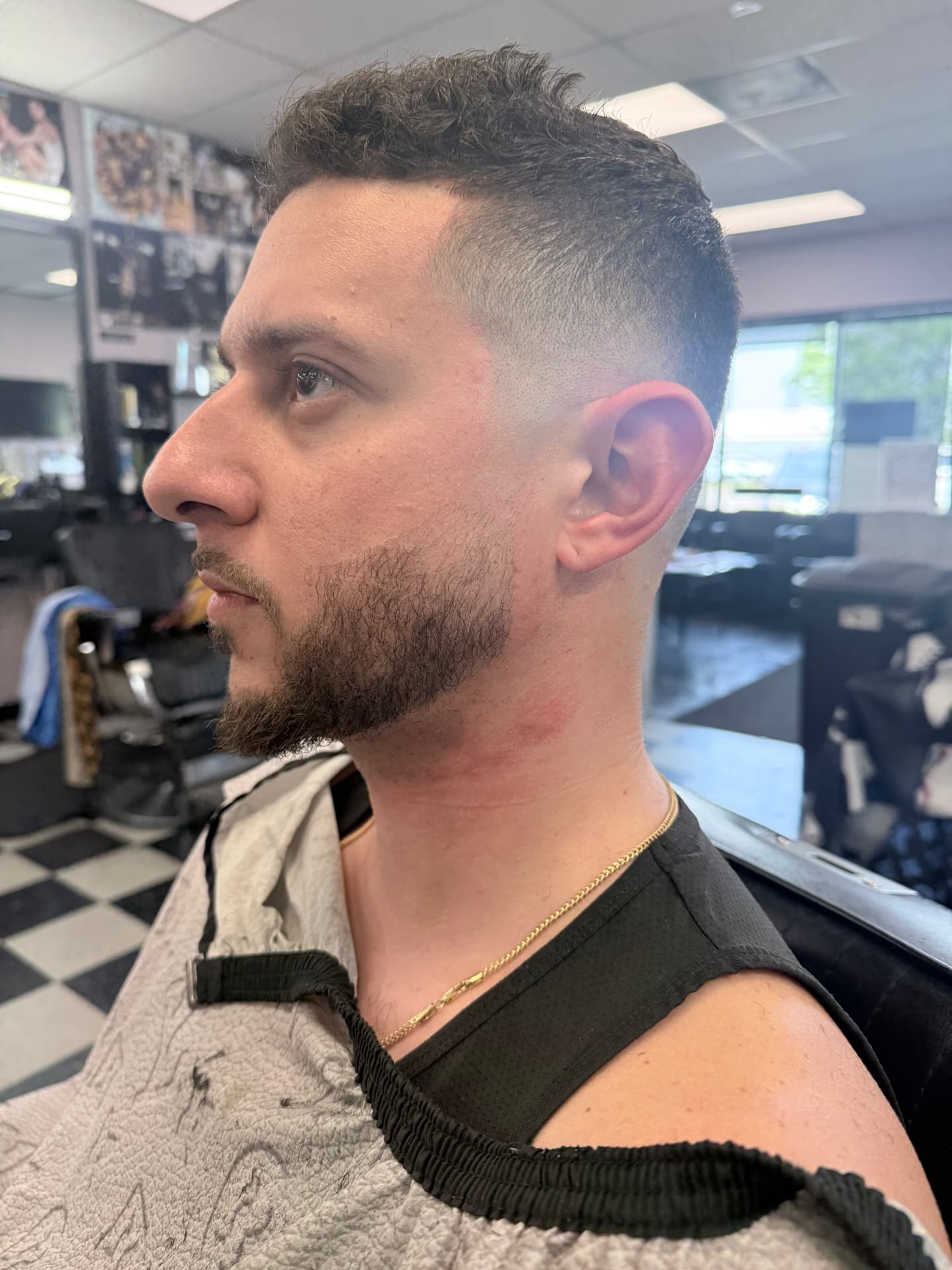 Textured haircut, fade, and shaped beard